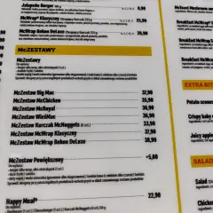 Fragment menu McDonald's z cenami zestawów McZestaw i pozycji z sekcji "Extra Bites" oraz "Salads".
